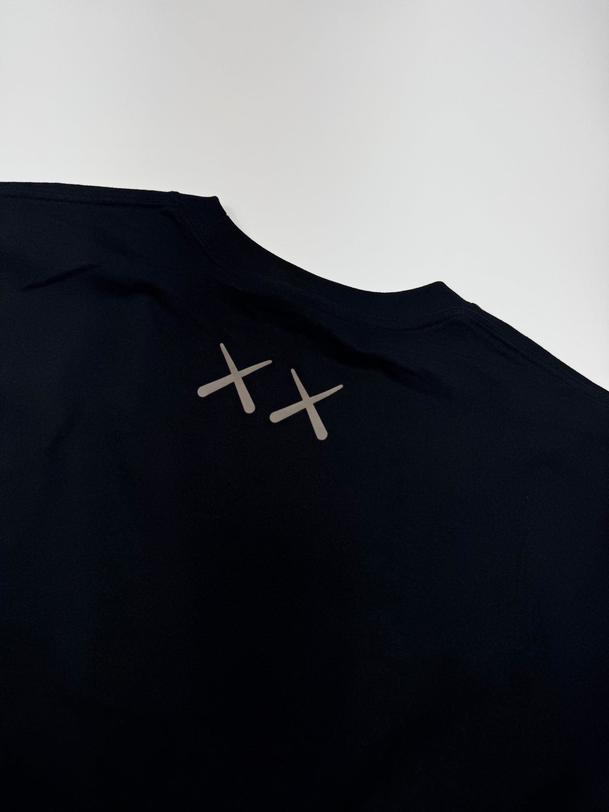 Kaws x Uniqlo Tee